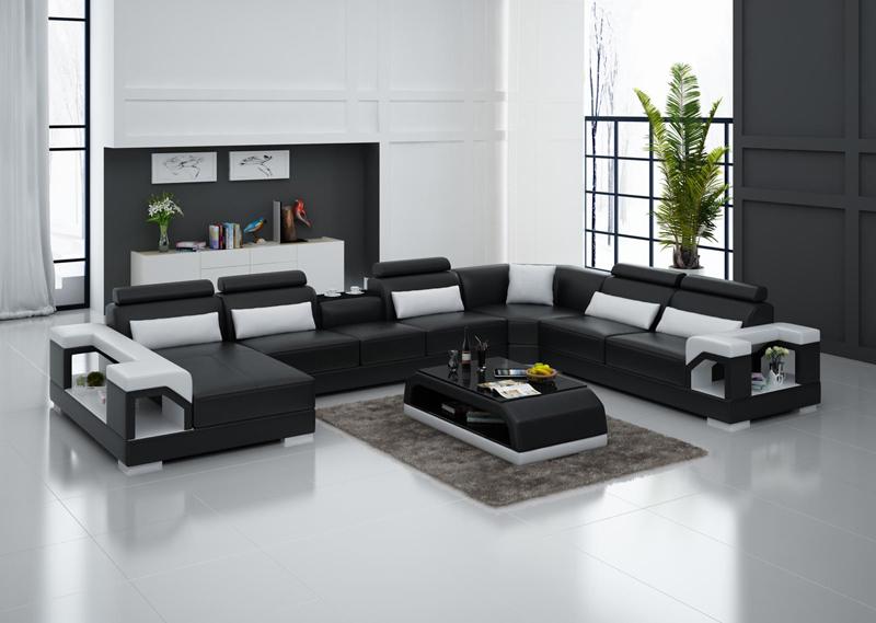 Betty U-soffa design i äkta skinn - Svart med vita detaljer